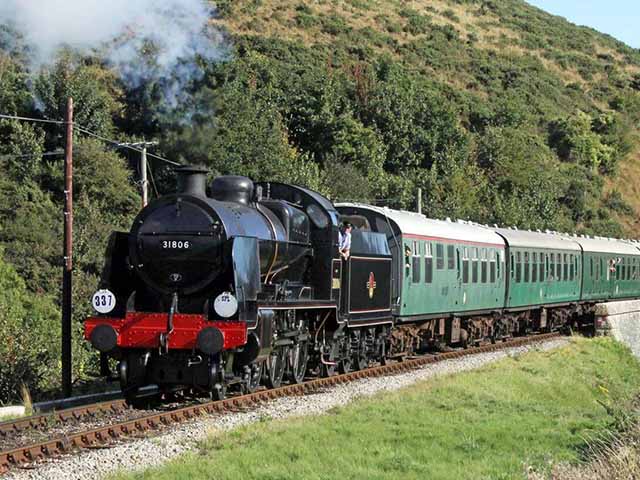 Join us for steam action with BR black U Class No.31806 hauling three-four green coaches